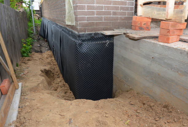 Happy homeowners after waterproofing job in Packwaukee